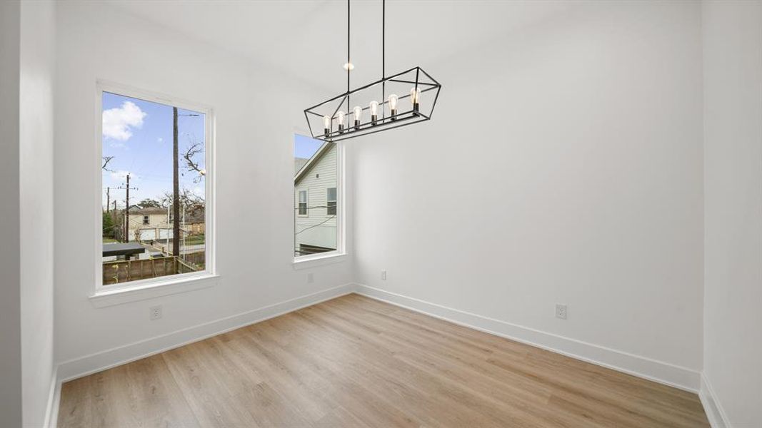 Incredible bonus space that is virtually staged as a dining room, could also make a fantastic home office.