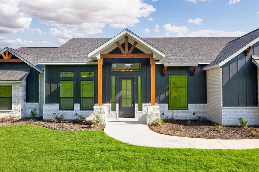 View of front of property featuring a front yard