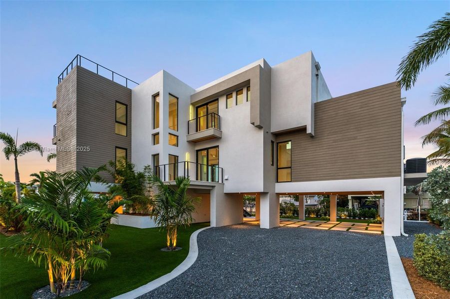 Front exterior of a new home in , Key Largo, FL, highlighting curb appeal (Image 1). Front exterior of a new home in , Key Largo, FL, highlighting curb appeal (Image 1).