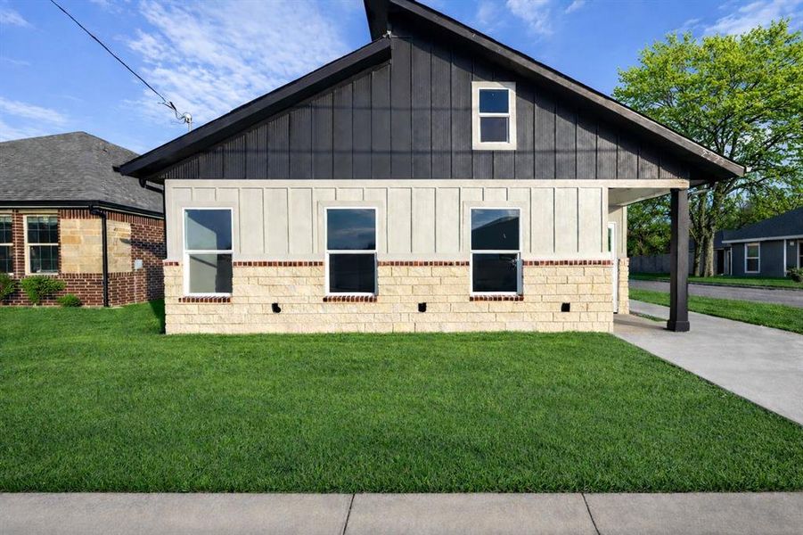 Front exterior of a new home in , Greenville, TX, highlighting curb appeal (Image 1). Front exterior of a new home in , Greenville, TX, highlighting curb appeal (Image 1).