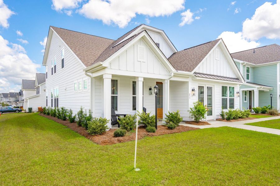 Front exterior of a new home in Tidewater at Lakes of Cane Bay, Summerville, SC, highlighting curb appeal (Image 1).