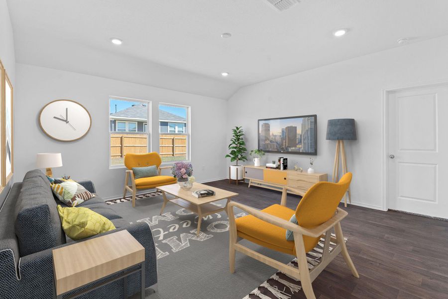 Living area with recessed lighting, vaulted ceiling, baseboards, and wood finished floors