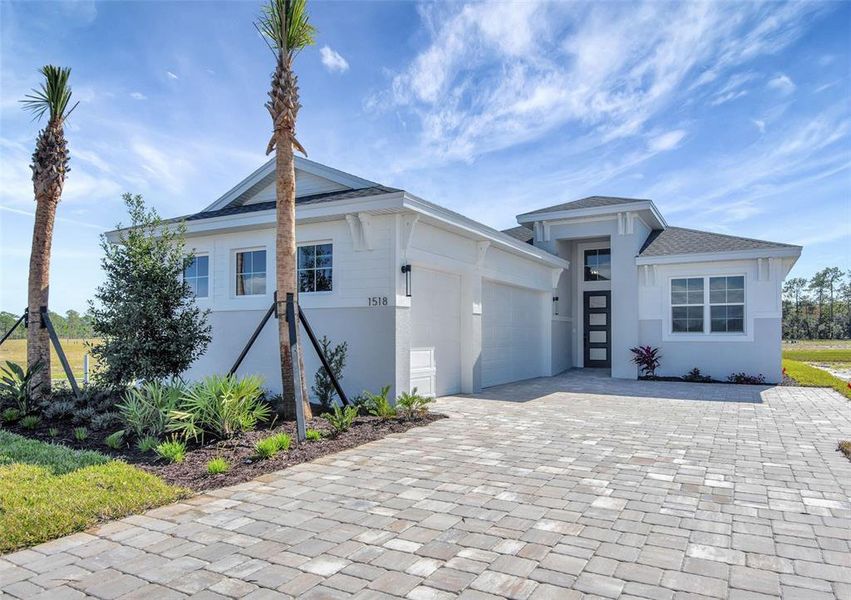 Front exterior of a new home in The Reserve at Victoria, Deland, FL, highlighting curb appeal (Image 2).
