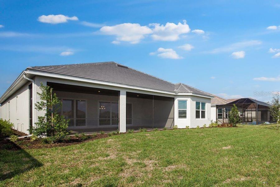 Exterior details and patio area of a home in Esplanade at Skye Ranch, Sarasota (Image 4).