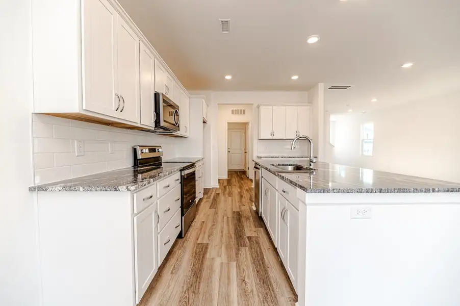 Representative furnished interior of a home built from the Bowen by McKee Homes in Pembroke, Hope Mills (Image 3).