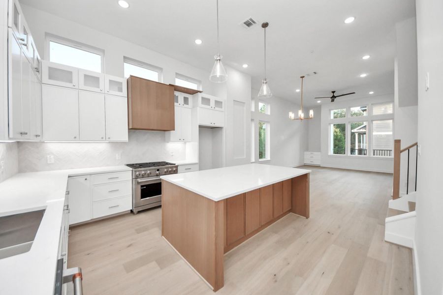 Pictures of model home, corner unit. Listing is of  the 2nd home in the row. Some finishes may vary.