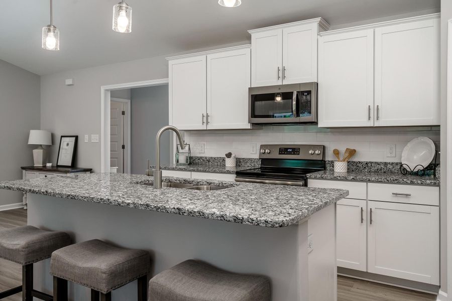 Representative furnished interior of a home built from the Chatham A by JC Jackson Homes,LLC in Heritage Pointe, Newport (Image 6).