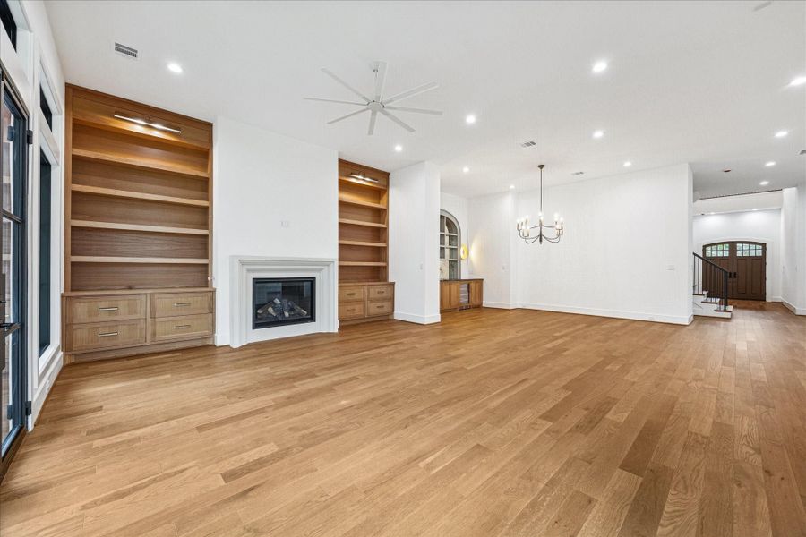 Soft tones, layered textures, and generous seating create an inviting setting for gatherings, while the open layout connects effortlessly to the kitchen and dining spaces. Soft tones, layered textures, and generous seating create an inviting setting for gatherings, while the open layout connects effortlessly to the kitchen and dining spaces.