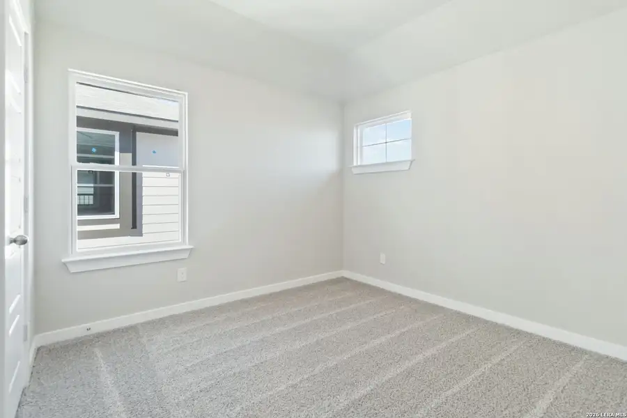 Spacious, unfurnished interior of a new home in Hunters Ranch, San Antonio (Image 23).