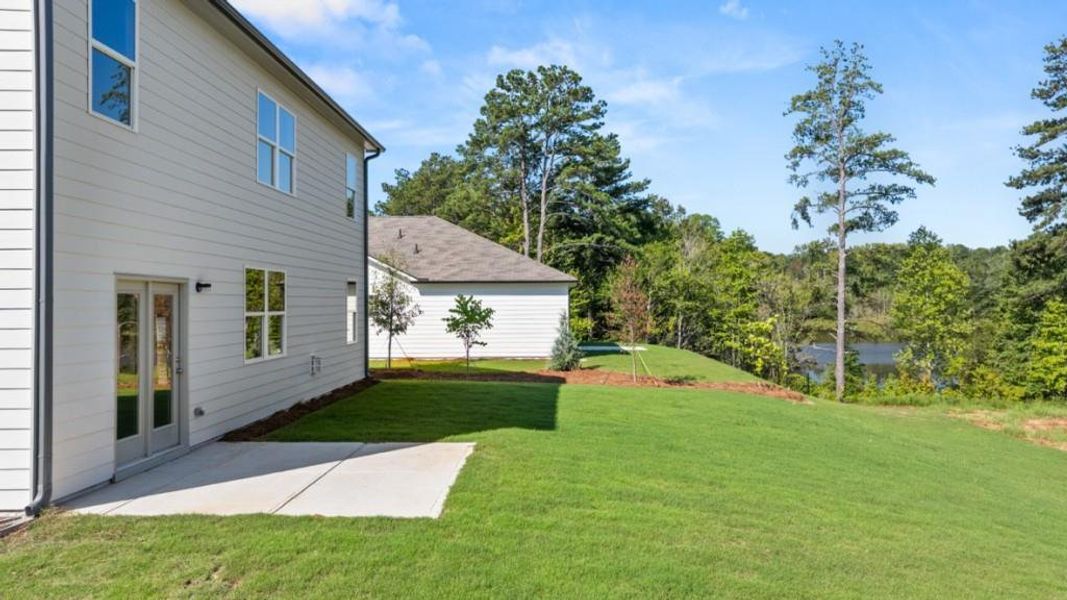Front exterior of a new home in Fairhaven, Lithia Springs, GA, highlighting curb appeal (Image 41). Front exterior of a new home in Fairhaven, Lithia Springs, GA, highlighting curb appeal (Image 41).