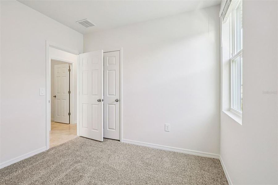 Spacious, unfurnished interior of a new home in Lake Deer Estates - Classic Series, Poinciana (Image 14).