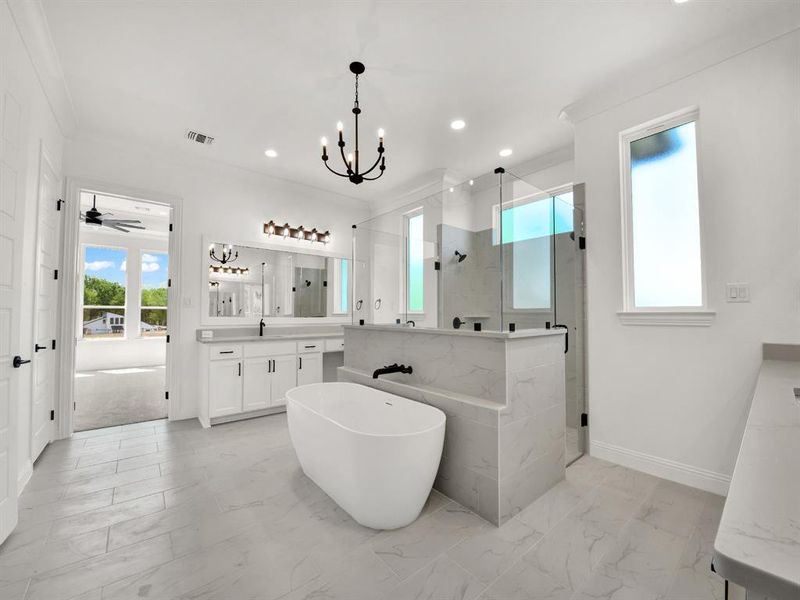 Bathroom with marble finish floor, vanity, a marble finish shower, and visible vents Bathroom with marble finish floor, vanity, a marble finish shower, and visible vents