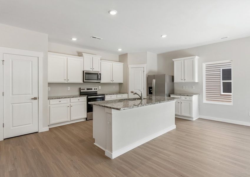 The kitchen is open to the living area The kitchen is open to the living area