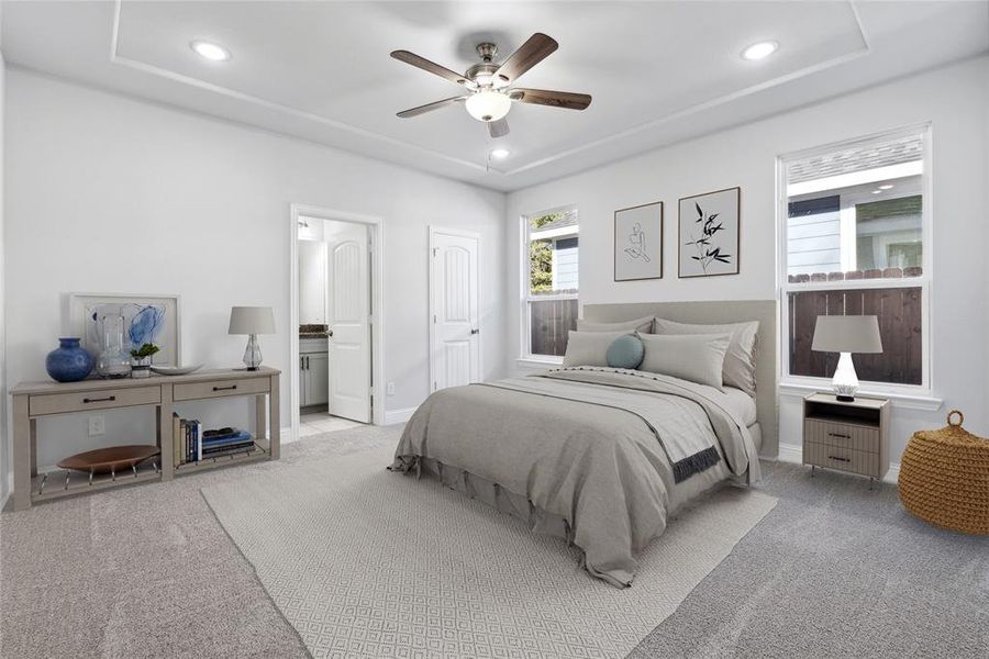 Carpeted bedroom with ceiling fan and connected bathroom