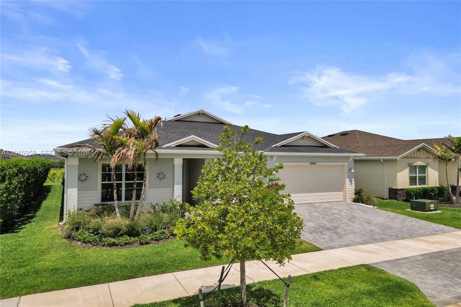 Front exterior of a new home in , Port St. Lucie, FL, highlighting curb appeal (Image 2). Front exterior of a new home in , Port St. Lucie, FL, highlighting curb appeal (Image 2).