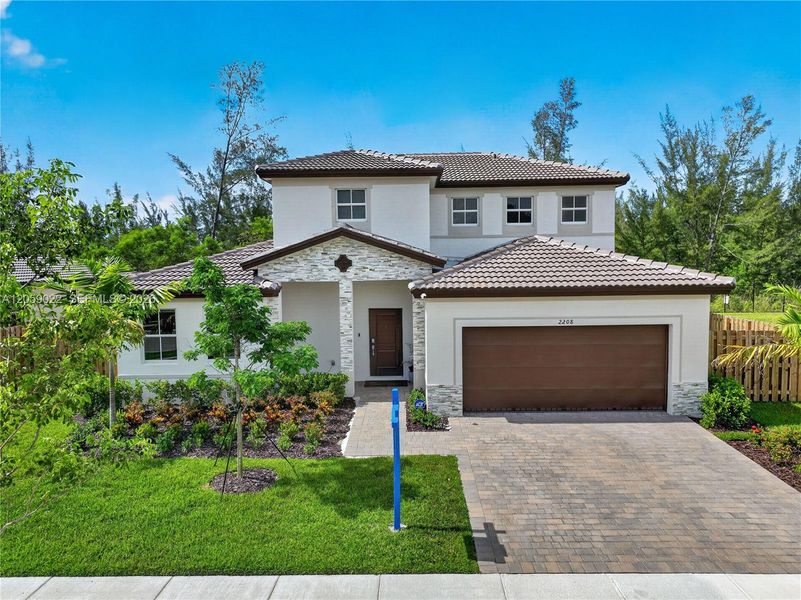 Front exterior of a new home in , Homestead, FL, highlighting curb appeal (Image 28). Front exterior of a new home in , Homestead, FL, highlighting curb appeal (Image 28).