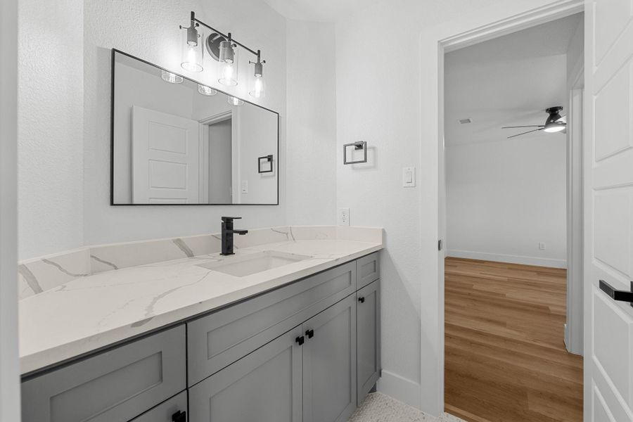 Luxurious custom cabinets and sleek quartz countertops enhance the modern design. Luxurious custom cabinets and sleek quartz countertops enhance the modern design.