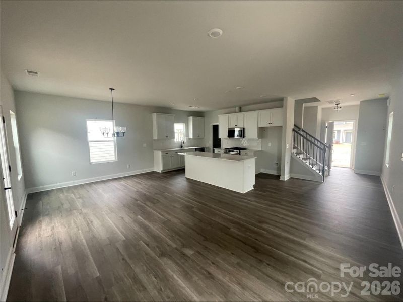 LVP in foyer, hall, kitchen, pantry, and breakfast area. 9' Kitchen island.