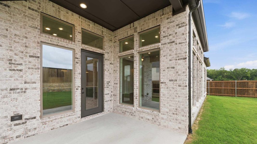 Exterior details and patio area of a home in The Parks at Wilson Creek, Celina (Image 3).