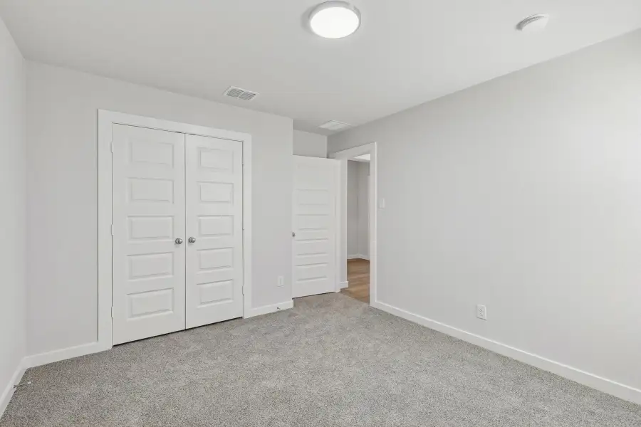 Bedroom in the Harrison home plan by Trophy Signature Homes – REPRESENTATIVE PHOTO Bedroom in the Harrison home plan by Trophy Signature Homes – REPRESENTATIVE PHOTO