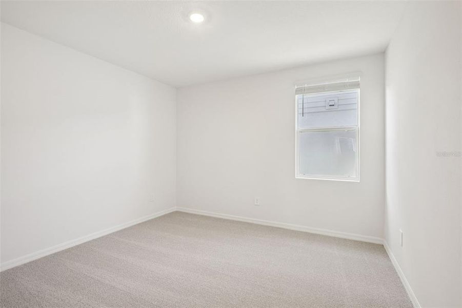 Spacious, unfurnished interior of a new home in The Grove at Stuart Crossing - Classic Series, Bartow (Image 36).