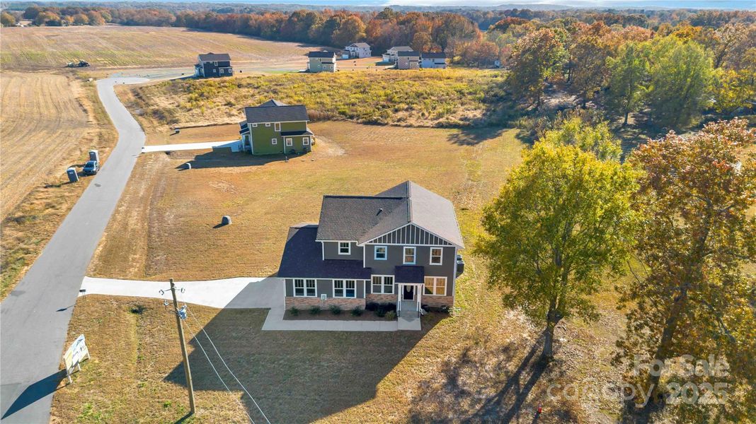Front exterior of a new home in , Monroe, NC, highlighting curb appeal (Image 25). Front exterior of a new home in , Monroe, NC, highlighting curb appeal (Image 25).