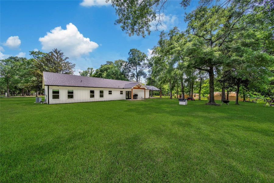 Exterior details and patio area of a home in , Splendora (Image 19).
