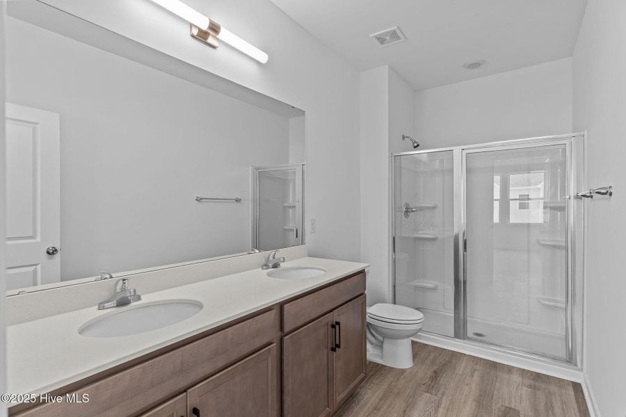 Furnished interior view inside a new home in Coastal Haven Townes, Leland (Image 14).