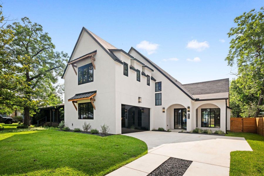 Architectural interest abounds with a striking gabled roofline and modern black-framed windows. Architectural interest abounds with a striking gabled roofline and modern black-framed windows.