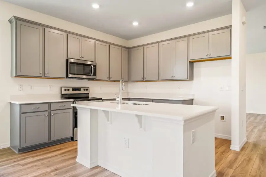 Representative furnished interior of a home built from the Jensen by Holiday Builders in Pineapple Grove, Port St. Lucie (Image 5).