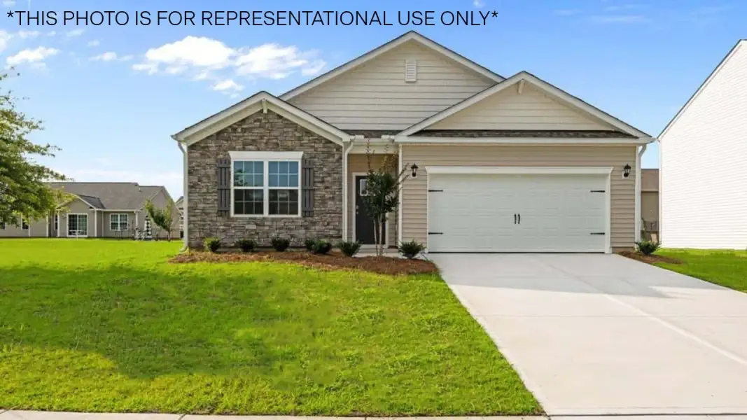 Front exterior of a new home in Saddlebrook, Rocky Mount, NC, highlighting curb appeal (Image 1). Front exterior of a new home in Saddlebrook, Rocky Mount, NC, highlighting curb appeal (Image 1).