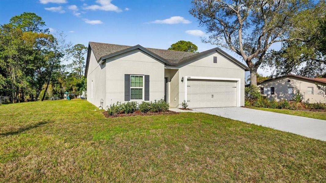 Front exterior of a new home in , Deltona, FL, highlighting curb appeal (Image 22).