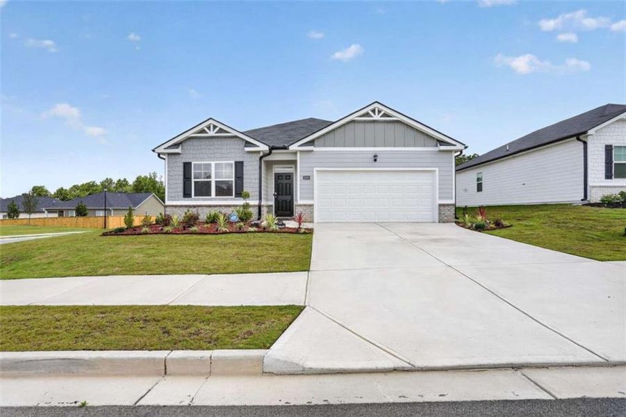 Front exterior of a new home in Champion's Run, Lithonia, GA, highlighting curb appeal (Image 21).