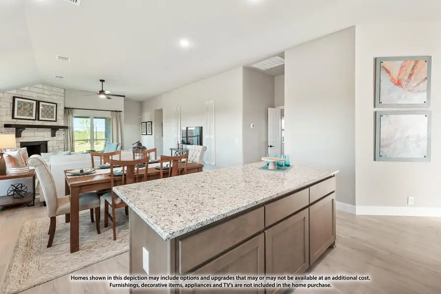 Kitchen island with granite countertop open to dining area and living room with stone fireplace Kitchen island with granite countertop open to dining area and living room with stone fireplace