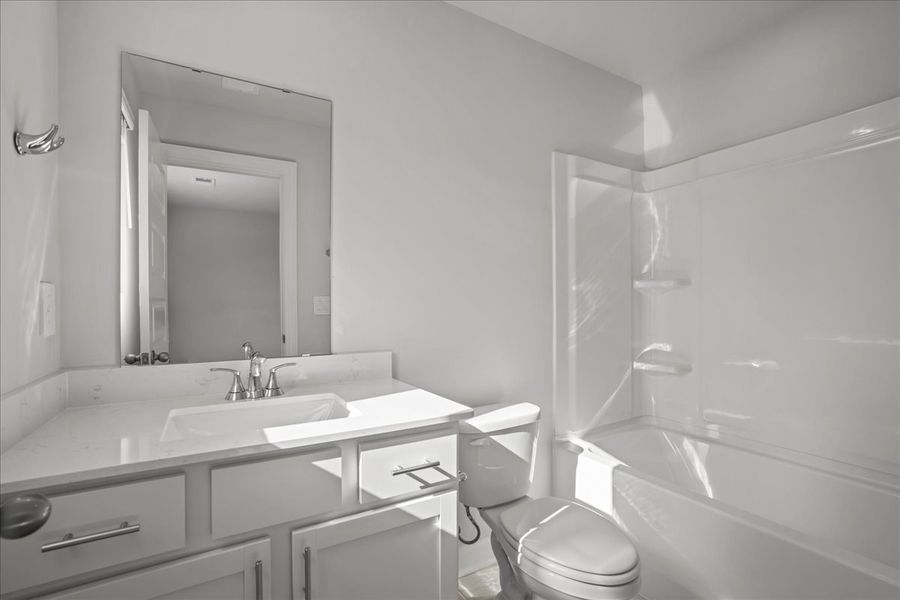 Furnished interior view inside a new home in The Farm at Wells Creek - Signature Collection, Gray Court (Image 4).