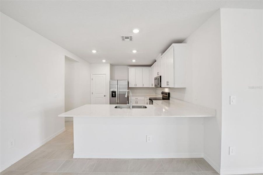 Furnished interior view inside a new home in Ridgehaven - Villas, Ormond Beach (Image 5).