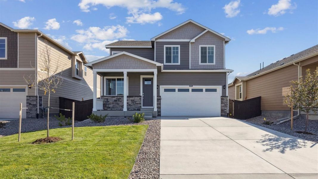 Front exterior of a new home in Settlers Crossing, Commerce City, CO, highlighting curb appeal (Image 1). Front exterior of a new home in Settlers Crossing, Commerce City, CO, highlighting curb appeal (Image 1).
