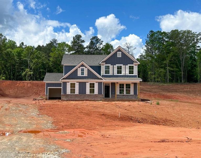 Front exterior of a new home in Pinegate, Covington, GA, highlighting curb appeal (Image 26).