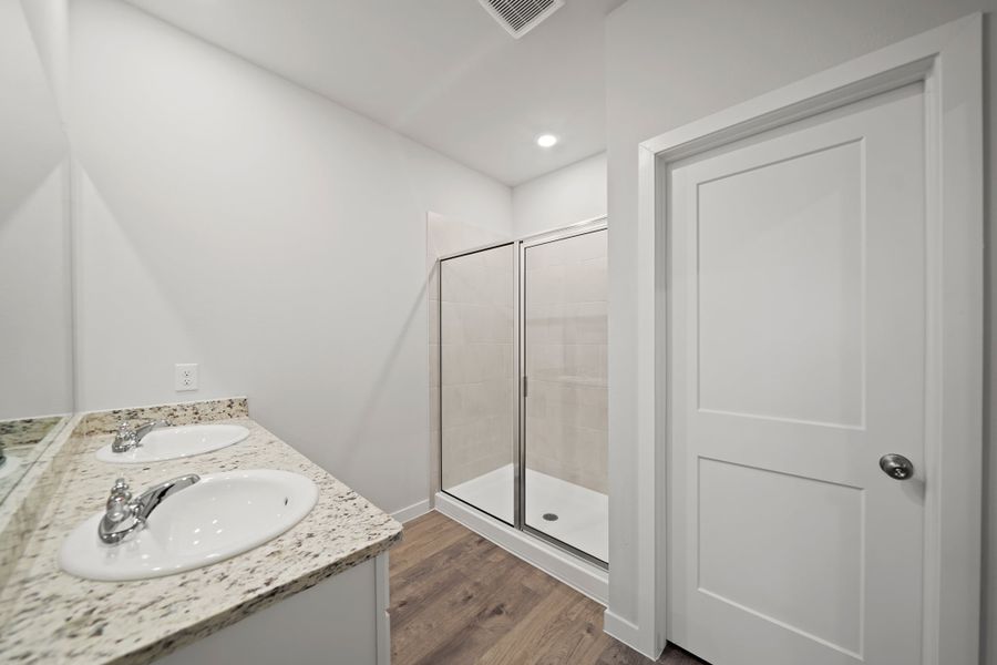 A bathroom with a glass shower.
