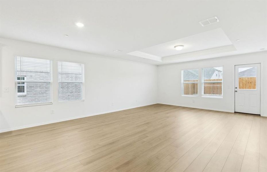 Dining nook off kitchen with large windows