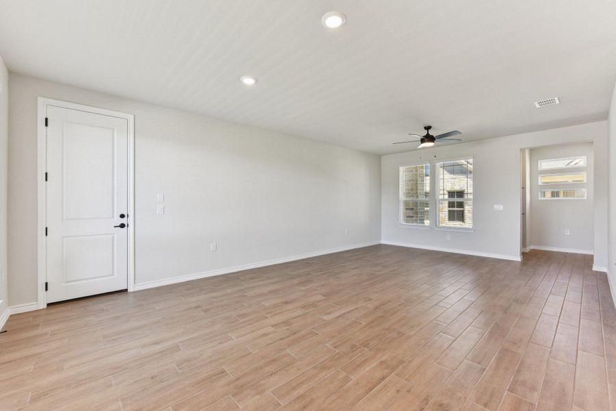 Spare room with recessed lighting, ceiling fan, and light wood finished floors