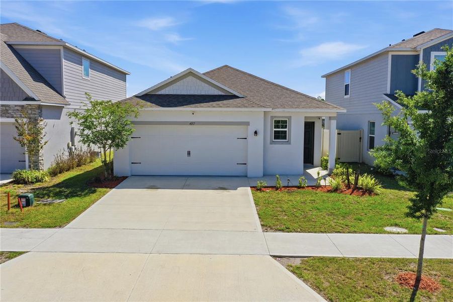 Front exterior of a new home in , St. Cloud, FL, highlighting curb appeal (Image 27).