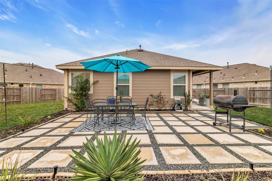 Another bonus in this yard is the beautiful paver patio with black star gravel. Plenty of room for a table, sitting area, grilling station, and a firepit.