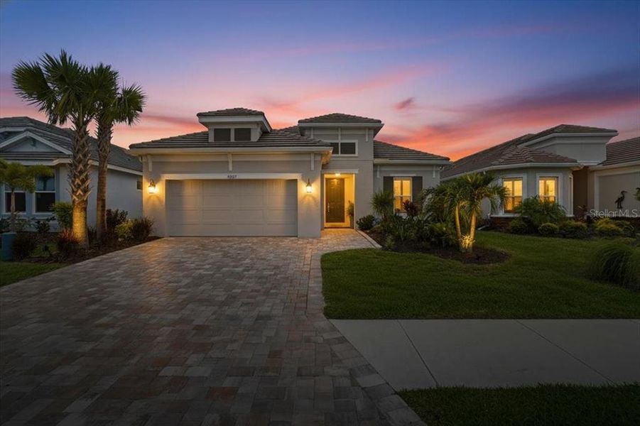 Front exterior of a new home in Esplanade at Artisan Lakes, Palmetto, FL, highlighting curb appeal (Image 23).