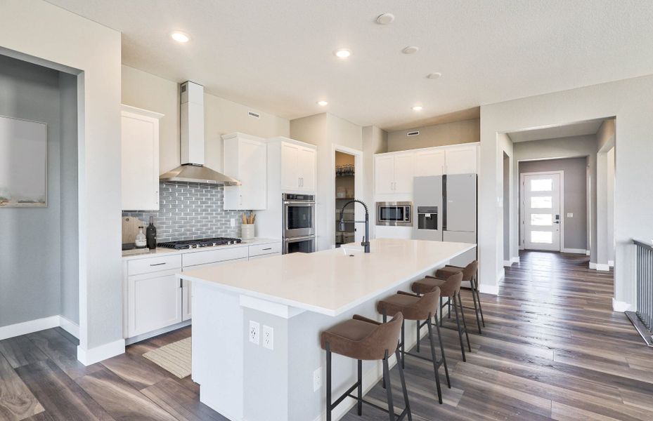 Furnished interior view inside a new home in Hilltop at Inspiration, Aurora (Image 7).