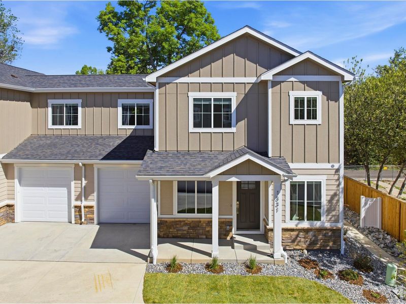 Front exterior of a new home in , Loveland, CO, highlighting curb appeal (Image 21).