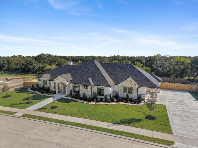 Front exterior of a new home in , College Station, TX, highlighting curb appeal (Image 26).