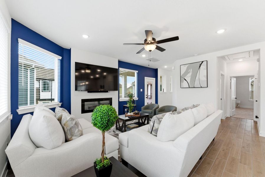 Spacious living room designed for comfort with plenty of seating and effortless connection to the kitchen and dining areas.