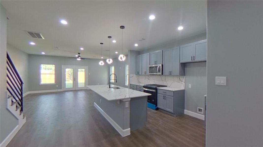 7918 James Franklin St kitchen sits between dining and living room.