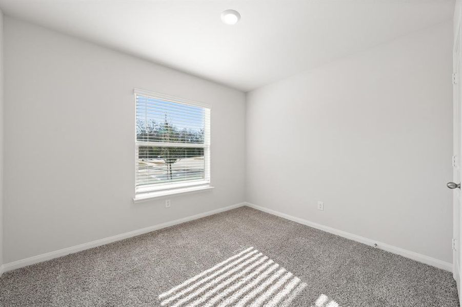 Spare room featuring carpet floors